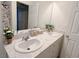 Bathroom with dual sinks, modern fixtures, and a large mirror at 9205 Valley Betica Ave, Las Vegas, NV 89148
