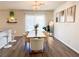 Elegant dining area with modern chandelier, stylish furniture, and a bright, airy ambiance at 9205 Valley Betica Ave, Las Vegas, NV 89148