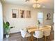 Bright dining room featuring modern decor, ample seating, and stylish chandelier for a welcoming atmosphere at 9205 Valley Betica Ave, Las Vegas, NV 89148