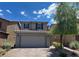 Charming two-story home with a well-maintained front yard, brick driveway, and a two-car garage at 9205 Valley Betica Ave, Las Vegas, NV 89148