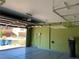 Spacious two-car garage with overhead storage racks and epoxy flooring to keep the space clean and organized at 9205 Valley Betica Ave, Las Vegas, NV 89148