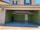 Clean garage with overhead storage, painted walls and finished floor at 9205 Valley Betica Ave, Las Vegas, NV 89148