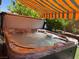 Luxurious hot tub featuring adjustable jets and retractable shade awning at 9205 Valley Betica Ave, Las Vegas, NV 89148