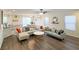 Spacious living room featuring comfortable seating, natural light, and open-concept layout with luxury vinyl plank at 9205 Valley Betica Ave, Las Vegas, NV 89148