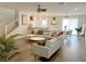 Bright, open-concept living room showcasing stylish decor, comfortable seating, and luxury vinyl plank flooring at 9205 Valley Betica Ave, Las Vegas, NV 89148