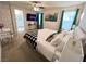 Bright main bedroom with white bedding, decorative pillows and art, and ceiling fan at 9205 Valley Betica Ave, Las Vegas, NV 89148