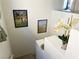 Staircase featuring golf themed art hanging on the walls, as well as a potted orchid at 9205 Valley Betica Ave, Las Vegas, NV 89148