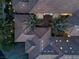 Aerial view of tiled roof and two palm trees in center of house at 9325 Canyon Classic Dr, Las Vegas, NV 89144