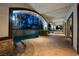 Spacious covered patio with outdoor seating and pool access at 9325 Canyon Classic Dr, Las Vegas, NV 89144