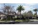Elegant two-story home boasts mature landscaping and a well-manicured lawn at 9325 Canyon Classic Dr, Las Vegas, NV 89144