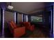 Home theater with projector, screen, and comfortable seating at 9325 Canyon Classic Dr, Las Vegas, NV 89144