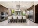 Spacious kitchen with island and modern stainless steel appliances at 9325 Canyon Classic Dr, Las Vegas, NV 89144
