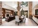 Bright and airy living room with a fireplace, tall windows, and elegant furnishings at 9325 Canyon Classic Dr, Las Vegas, NV 89144
