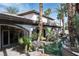 Tranquil swimming pool surrounded by lush landscaping and the beautiful design of the home at 9325 Canyon Classic Dr, Las Vegas, NV 89144