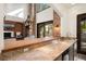Wet bar with stone countertops, stainless steel appliances, and seamless access to the main living area at 9325 Canyon Classic Dr, Las Vegas, NV 89144