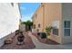 Property featuring low maintenance backyard with a walkway, landscaping, and full privacy at 9449 Amber Valley Ln, Las Vegas, NV 89134