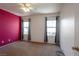 Bedroom featuring two windows and carpeted floor at 9449 Amber Valley Ln, Las Vegas, NV 89134
