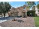 Attractive home showcasing a well-manicured lawn, beautiful landscaping, and a cozy covered porch at 9449 Amber Valley Ln, Las Vegas, NV 89134