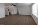 Bright and spacious living room with modern flooring, neutral paint, and plenty of natural light at 9449 Amber Valley Ln, Las Vegas, NV 89134