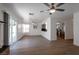 Open-concept living room with wood flooring, kitchen, and access to the backyard at 9449 Amber Valley Ln, Las Vegas, NV 89134