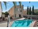 Inviting backyard features a sparkling pool with a spa, perfect for outdoor entertaining and relaxation at 9449 Amber Valley Ln, Las Vegas, NV 89134