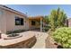 Outdoor area with covered patio, decorative wall and built-in fire pit at 950 Marbelwood Ave, Las Vegas, NV 89123
