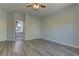 This bedroom offers wood-look flooring, neutral paint, and ample space at 950 Marbelwood Ave, Las Vegas, NV 89123