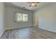 This bedroom offers wood-look flooring, neutral paint, and a closet at 950 Marbelwood Ave, Las Vegas, NV 89123