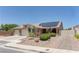 Charming single-story home featuring a well-maintained yard, brick driveway, three-car garage and solar panels at 950 Marbelwood Ave, Las Vegas, NV 89123