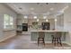 Stylish kitchen featuring a breakfast bar, modern appliances, ample counter space, and bright, natural light at 950 Marbelwood Ave, Las Vegas, NV 89123
