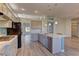 Well-designed kitchen with stainless steel appliances, granite countertops, a large island, and ample cabinet space at 950 Marbelwood Ave, Las Vegas, NV 89123