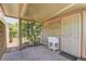Covered patio with wash basin and adjacent to mature plantings and brick pavers at 950 Marbelwood Ave, Las Vegas, NV 89123