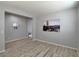 Spacious living room with wood-look floors is bright and airy, perfect for relaxing and entertaining at 9604 Vital Crest St, Las Vegas, NV 89123