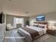 Well-staged main bedroom features modern furnishings, natural light, and scenic decor for relaxation at 9604 Vital Crest St, Las Vegas, NV 89123