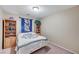Cozy bedroom with natural lighting, built-in shelving, and decorative quilt at 967 Coronado Peak Ave, Las Vegas, NV 89183