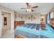 Spacious bedroom features ceiling fan, carpet, and natural light coming in from two windows at 967 Coronado Peak Ave, Las Vegas, NV 89183