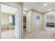 Hallway with neutral walls and carpet, showing access to multiple rooms of the house at 967 Coronado Peak Ave, Las Vegas, NV 89183