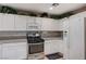 Kitchen with white cabinets, and a stainless steel oven at 967 Coronado Peak Ave, Las Vegas, NV 89183