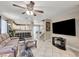 Comfortable living room with tile flooring, a ceiling fan, and easy access to the kitchen at 967 Coronado Peak Ave, Las Vegas, NV 89183