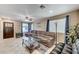 Living room showcasing tile flooring, a ceiling fan, and natural light at 967 Coronado Peak Ave, Las Vegas, NV 89183