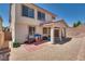 Backyard features a covered patio, gravel groundcover, block wall, and desert landscaping at 9746 Vista Cache Ct, Las Vegas, NV 89148
