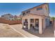 The backyard features a covered patio, gravel groundcover, block wall, and desert landscaping at 9746 Vista Cache Ct, Las Vegas, NV 89148