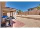 Covered patio features brick and gravel groundcover, desert landscaping, and block wall at 9746 Vista Cache Ct, Las Vegas, NV 89148