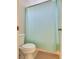 Bathroom features a toilet and shower with light-blue curtain, and a neutral color scheme at 9746 Vista Cache Ct, Las Vegas, NV 89148