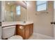 Clean bathroom featuring a vanity with ample lighting and a glass-enclosed shower at 9746 Vista Cache Ct, Las Vegas, NV 89148