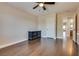Bedroom featuring wood floors, ceiling fan, and natural light with a dark dresser at 9746 Vista Cache Ct, Las Vegas, NV 89148