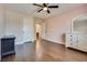 Bedroom featuring wood floors, ceiling fan, and natural light with a closet and dresser at 9746 Vista Cache Ct, Las Vegas, NV 89148