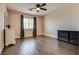 Bedroom featuring wood floors, ceiling fan, and natural light, with a closet and dressers at 9746 Vista Cache Ct, Las Vegas, NV 89148