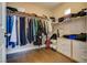 Walk-in closet with shelving, hanging racks, and built-in drawers at 9746 Vista Cache Ct, Las Vegas, NV 89148