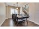 Dining room featuring a large table with seating for eight and a view of the staircase at 9746 Vista Cache Ct, Las Vegas, NV 89148